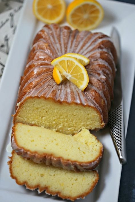 This Meyer Lemon Greek Yogurt Loaf with Vanilla Lemon Glaze from CookingInStilettos.com is a must for the brunch table. A cross between a quick bread and a pound cake, this moist and rich bread is packed with lemon flavor with a hint of vanilla and perfect slathered with jam or on its own. If you love the lemon loaf from the local coffee house, you are going to love this recipe. Lemon Loaf | Quick Bread | Loaf Cake | Vanilla | Brunch | Breakfast | Greek Yogurt Cake
