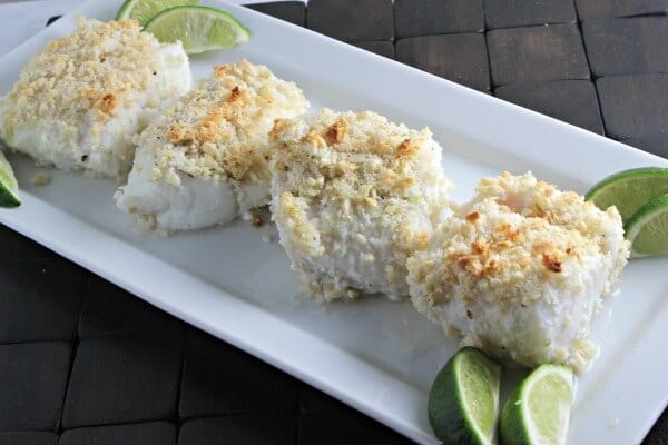 Baked Cod goes from ordinary to extraordinary when it melds with coconut, almonds and a hint of lime. This Coconut Almond Crusted Cod recipe from CookingInStilettos.com will be a family favorite! | Cod Recipes | Coconut | Seafood | Baked Fish | Easy 30 Minute Recipe | Tropical Recipe