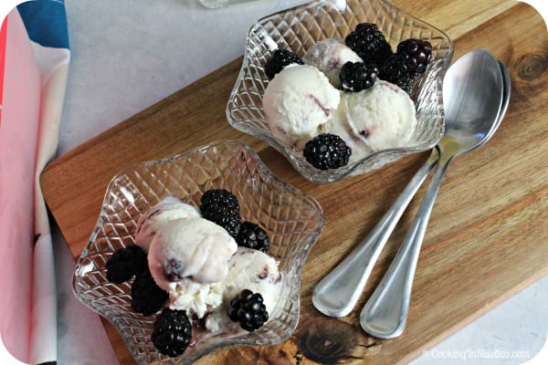 This refreshing and easy no churn Margarita Ice Cream with Blackberry Ripple from CookingInStilettos.com is so easy to make - no ice cream machine required! For a sweet boozy treat, you'll want to whip this up! No Churn Ice Cream | Tequila | Margarita | Boozy Bite | Sweet Treat | Desserts | Blackberries