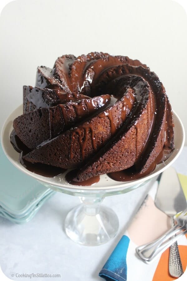 This Chocolate Stout Bundt Cake from CookingInStilettos.com is a showstopper. So easy to make and decadent, drizzled with a bit of extra chocolate - what's not to love? | @CookInStilettos