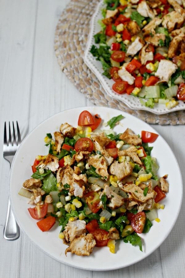 Grilled Southwestern Chicken Salad from CookingInStilettos.com brings the flavor with spice rubbed chicken, grilled veggies, crisp romaine lettuce & drizzled with a honey lime vinaigrette. This will be your go-to summer salad | Southwestern | Grilling | Chicken | Summer Salads | Dinner Salad