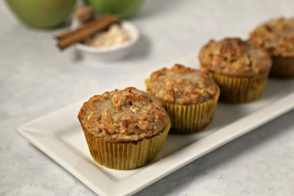 Apple Oatmeal Muffins from CookingInStilettos.com are perfect for fall - tart crisp Granny Smith apples are folded into moist and delicious oatmeal muffins and drizzled with a sweet applesauce glaze. | Apple Oatmeal Muffin | Oatmeal Muffins | Spiced Apple Muffin | Granny Smith Apples | Oatmeal | Applesauce | Fall Breakfast Recipes | Fall Baking | Easy Muffin Recipe | Breakfast | Brunch