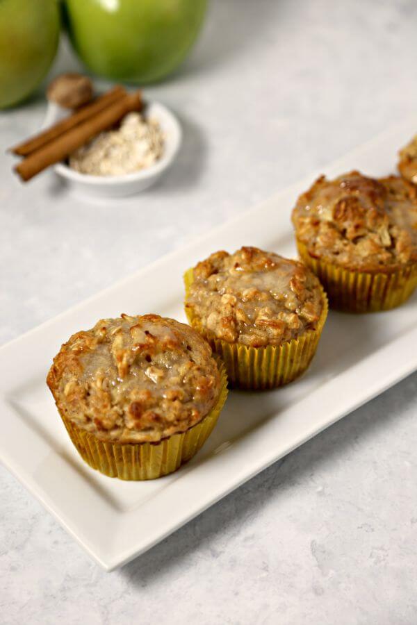 Apple Oatmeal Muffins from CookingInStilettos.com are perfect for fall - tart crisp Granny Smith apples are folded into moist and delicious oatmeal muffins and drizzled with a sweet applesauce glaze. | Apple Oatmeal Muffin | Oatmeal Muffins | Spiced Apple Muffin | Granny Smith Apples | Oatmeal | Applesauce | Fall Breakfast Recipes | Fall Baking | Easy Muffin Recipe | Breakfast | Brunch