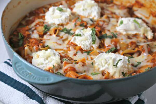 This Rustic Skillet Lasagna from CookingInStilettos.com is a delicious and easy weeknight dinner idea. This skillet lasagna recipe goes from stovetop to table in about 30 minutes | Skillet Lasagna | One Pot Meal | 30 Minute Meal | Easy Weeknight Recipe | Easy Pasta Recipe | Dinner Made Easy