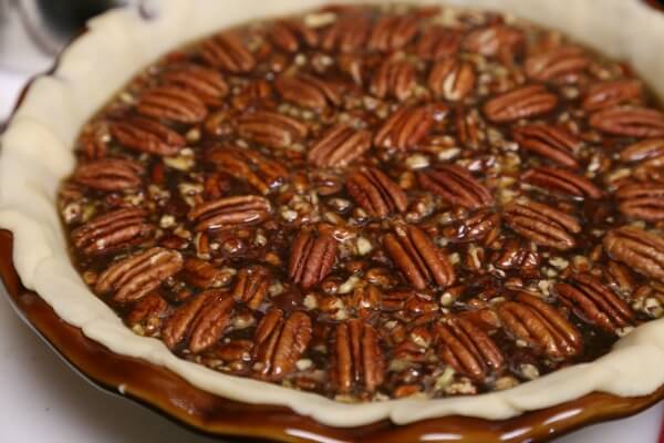 Chocolate Bourbon Pecan Pie - Ready for the Oven | CookingInStilettos.com