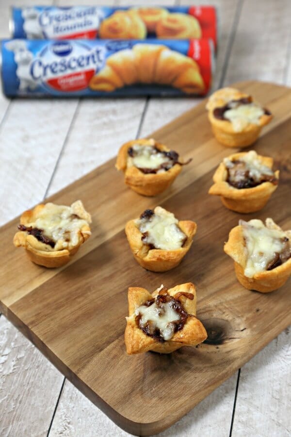 French Onion Bites from CookingInStilettos.com have the flavors of the classic soup in a chic appetizer. Buttery Pillsbury Crescent Roll dough is baked with richly caramelized onions and savory fontina cheese. | Appetizer | Caramelized Onions | French Onion Soup | Chic Appetizer | Comfort Food Recipe | Easy Entertaining