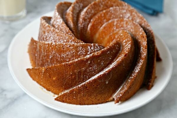 Bourbon Soaked Eggnog Cake from CookingInStilettos.com is a dessert showstopper. A moist rich eggnog cake with hints of spice and bourbon and drizzled with a bourbon eggnog glaze.