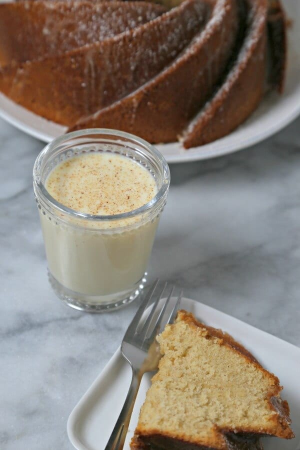 Bourbon Soaked Eggnog Cake from CookingInStilettos.com is a dessert showstopper. A moist rich eggnog cake with hints of spice and bourbon and drizzled with a bourbon eggnog glaze.