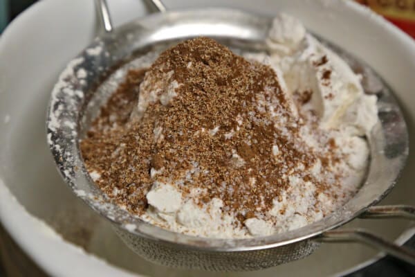 Bourbon Soaked Eggnog Cake - Sifting the Dry Ingredients | CookingInStilettos.com