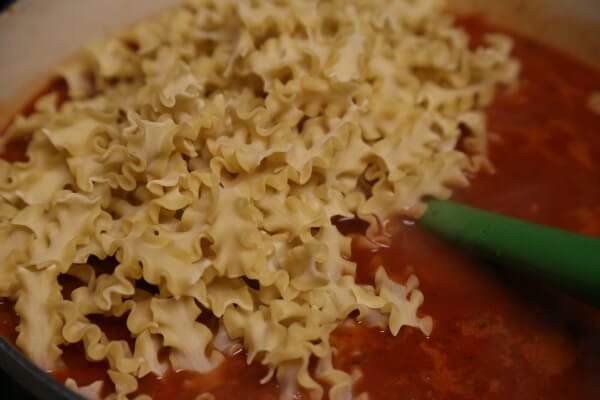 Easy Three Cheese Lasagna Soup - Adding the Pasta | CookingInStilettos.com