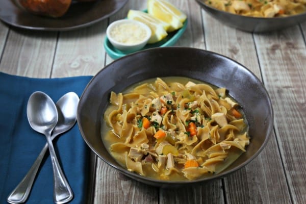 This Lemon Chicken Noodle Soup from CookingInStilettos.com is a modern twist on a classic. Rotisserie chicken is simmered with noodles and veggies in a bright citrus Parmesan broth. What's not to love? | @CookInStilettos | Homemade Chicken Noodle Soup | 30 Minute Meal | Easy Soup Recipe | Leftover Recipes | Rotisserie Chicken Recipes | Lemon Broth
