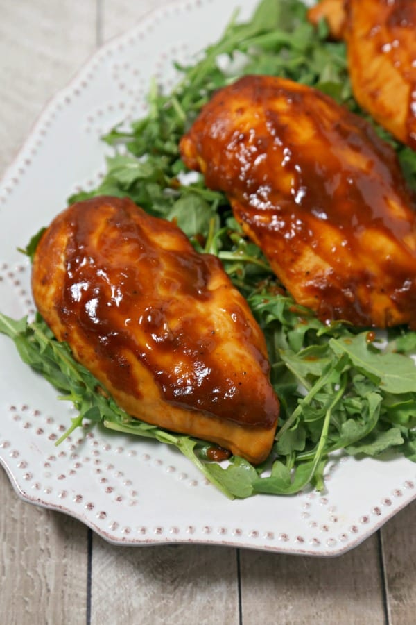 This Oven Baked Chicken with Kona Coffee Barbecue Sauce from CookingInStilettos.com is what's for dinner. Tender chicken is simmered in a flavorful Kona coffee barbecue sauce that is made with just a few pantry ingredients. This will be a family favorite recipe | @CookInStilettos
