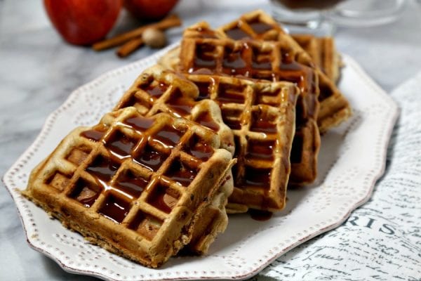 These delicious Apple Pancetta Waffles with Bourbon Cider Syrup from CookingInStilettos.com are the perfect meld of sweet and savory, with fluffy waffles studded with apples, toasted pecans and crisp pancetta and drizzled with a boozy apple cider syrup | @CookInStilettos