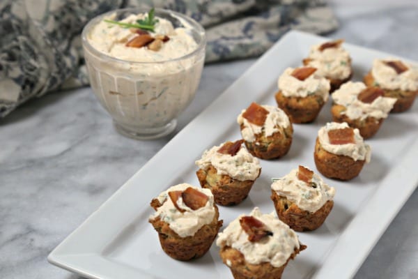 These bite-size Bacon Thyme Scones with Savory Whipped Ricotta from CookingInStilettos.com are a delicious bite for any party! Bacon and fresh thyme are baked into mini muffin scones with a herby cheesy whipped ricotta dolloped on top. What's not to love? | @CookInStilettos