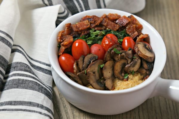 For your next brunch or when you want breakfast for dinner, make this Savory Oatmeal with Bacon, Spinach and Blistered Tomatoes from CookingInStilettos.com. This savory oatmeal recipe will be a chic and comforting favorite | @CookInStilettos