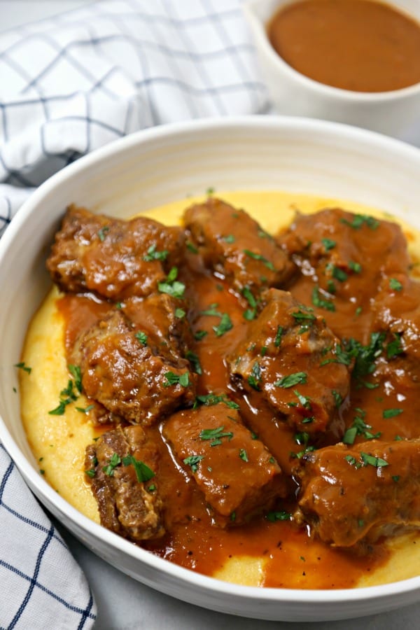 Cinnamon Spiced Slow Cooker Short Ribs from CookingInStilettos.com are the ultimate autumn dish. Rich beef short ribs are simmered for hours in a silky cinnamon spiced broth with a secret ingredient. This is the perfect comfort food recipe and so easy to make!