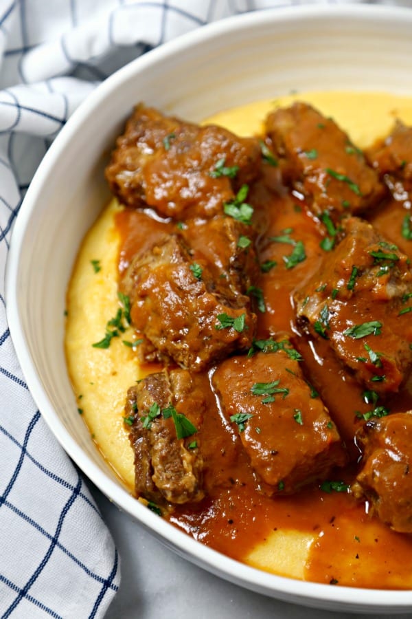 Cinnamon Spiced Slow Cooker Short Ribs from CookingInStilettos.com are the ultimate autumn dish. Rich beef short ribs are simmered for hours in a silky cinnamon spiced broth with a secret ingredient. This is the perfect comfort food recipe and so easy to make! 