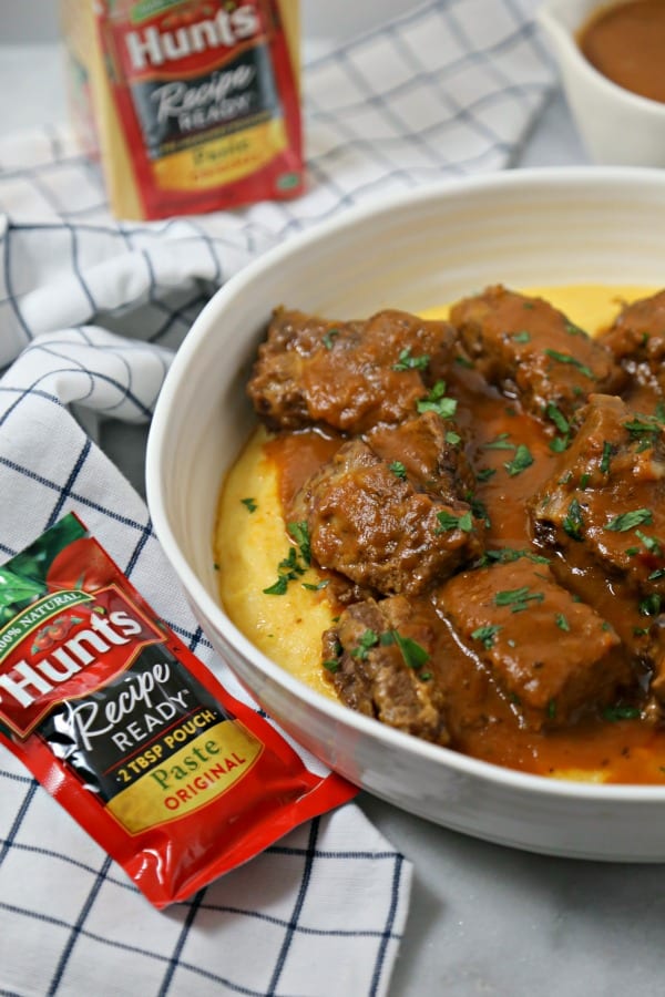 Cinnamon Spiced Slow Cooker Short Ribs from CookingInStilettos.com are the ultimate autumn dish. Rich beef short ribs are simmered for hours in a silky cinnamon spiced broth with a secret ingredient. This is the perfect comfort food recipe and so easy to make!