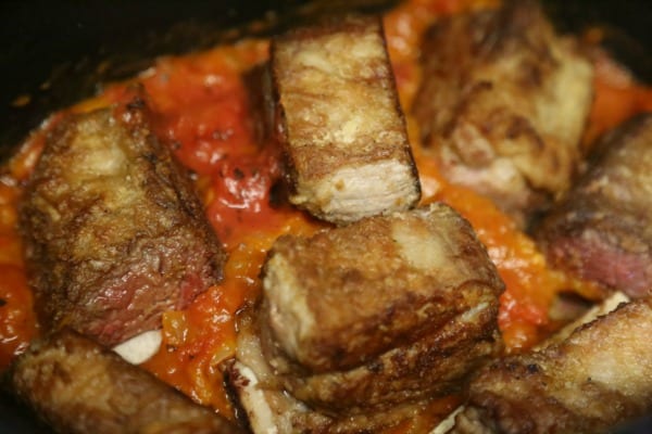 Cinnamon Spiced Slow Cooker Short Ribs - Nestling the Short Ribs in the Sauce | CookingInStilettos.com