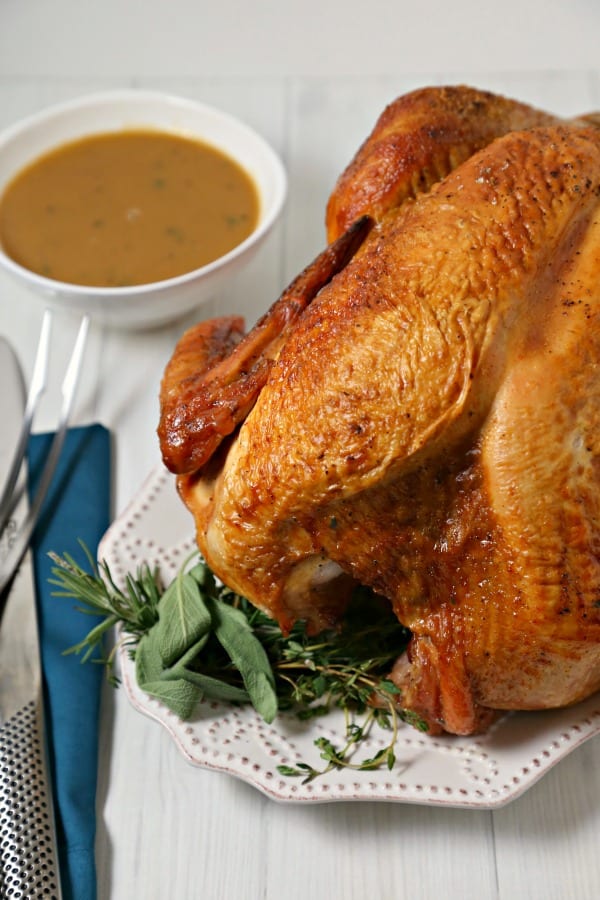 This Mustard Maple Glazed Roast Turkey with Homemade Gravy from CookingInStilettos.com is a flavorful twist on a classic roast turkey recipe. Golden roast turkey is glazed with a sweet and spicy mustard maple glaze that is packed with flavor and perfect for your holiday menu.