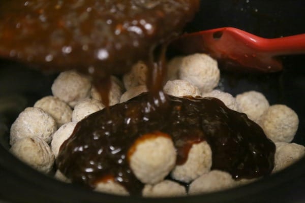 Slow Cooker Hawaiian Meatballs - Adding the Sauce | CookingInStilettos.com