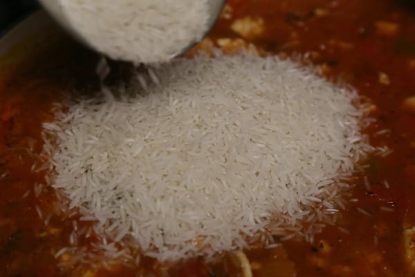 Stuffed Pepper Soup - Adding the Rice | CookingInStilettos.com