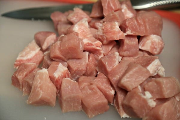Slow Cooker Pork Tinga with Potatoes, Avocado and Fresh Cheese - Cubing the Pork | CookingInStilettos.com