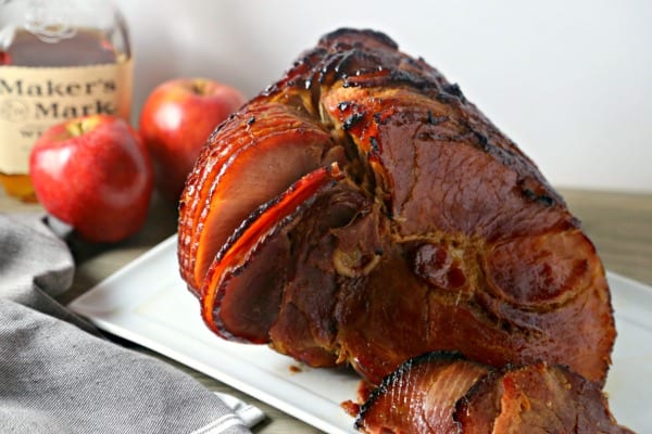 Bourbon Cider Glazed Ham from CookingInStilettos.com is the perfect holiday ham recipe! Just a few ingredients is all you need for a ham glazed to perfection with a hint of smoky sweetness! Ham | Bourbon | Apple Cider | Easy Recipe | Holiday | Easter 