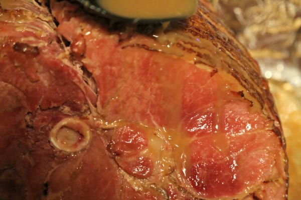 Bourbon Cider Glazed Ham - Glazing the Ham | CookingInStilettos.com