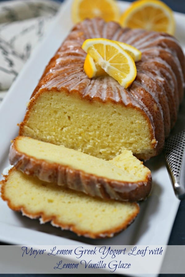 This Meyer Lemon Greek Yogurt Loaf with Vanilla Lemon Glaze from CookingInStilettos.com is a must for the brunch table. A cross between a quick bread and a pound cake, this moist and rich bread is packed with lemon flavor with a hint of vanilla and perfect slathered with jam or on its own. If you love the lemon loaf from the local coffee house, you are going to love this recipe. #Brunchweek Lemon Loaf | Quick Bread | Loaf Cake | Vanilla | Brunch | Breakfast | Greek Yogurt Cake 