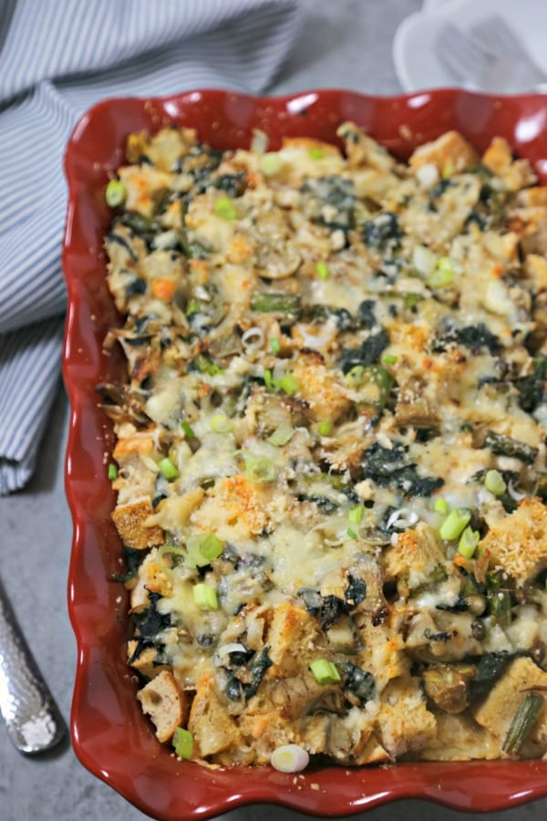 This Spinach Artichoke and Asparagus Strata from CookingInStilettos.com is packed with layers of flavor, fresh veggies and sharp cheddar cheese - a make-ahead dish perfect for brunch! #BrunchWeek Strata | Breakfast | Brunch | Casserole | Make Ahead Recipe