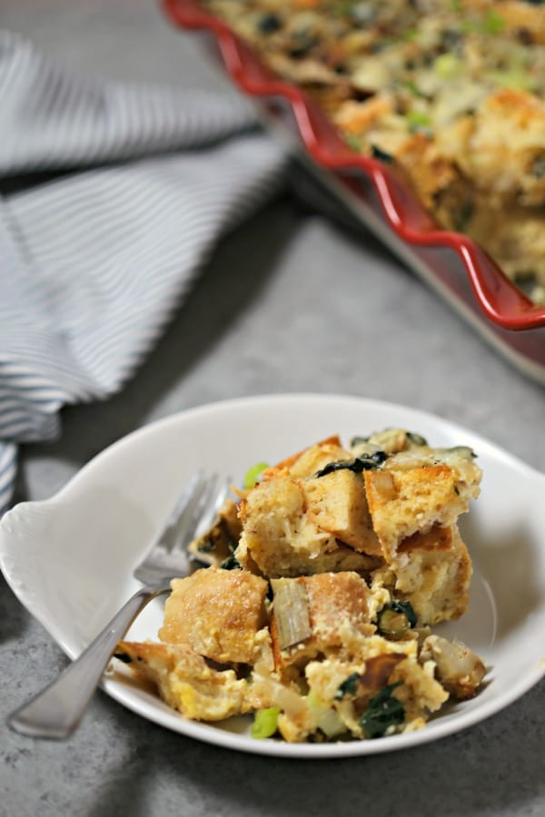 This Spinach Artichoke and Asparagus Strata from CookingInStilettos.com is packed with layers of flavor, fresh veggies and sharp cheddar cheese - a make-ahead dish perfect for brunch! #BrunchWeek Strata | Breakfast | Brunch | Casserole | Make Ahead Recipe