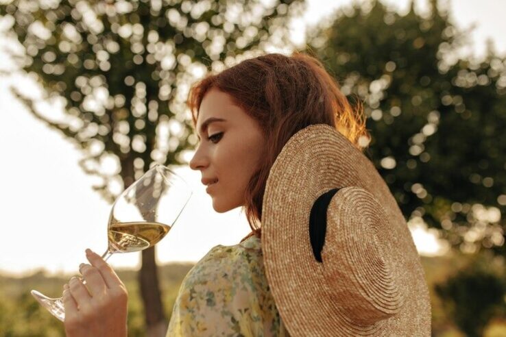 young woman drink white wine