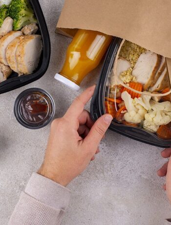 hands holding food pack